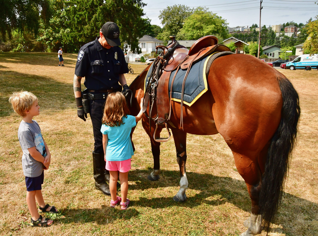 Jackson the horse who serves with the SPD mounted patrol was hit with kids. Photo by Patrick Robinson