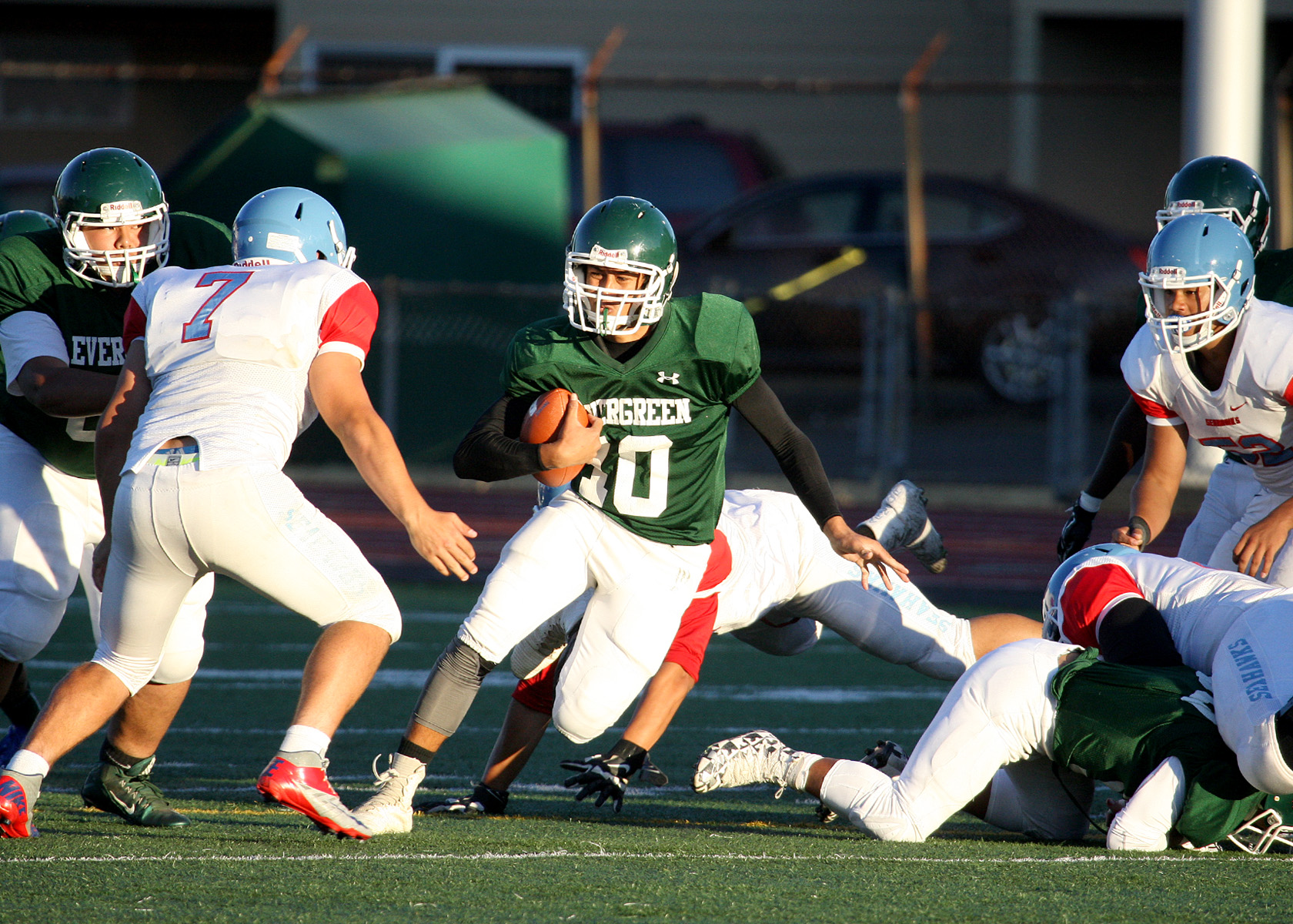 Frankie Sailiata of Evergreen scrambles to gain some yards.