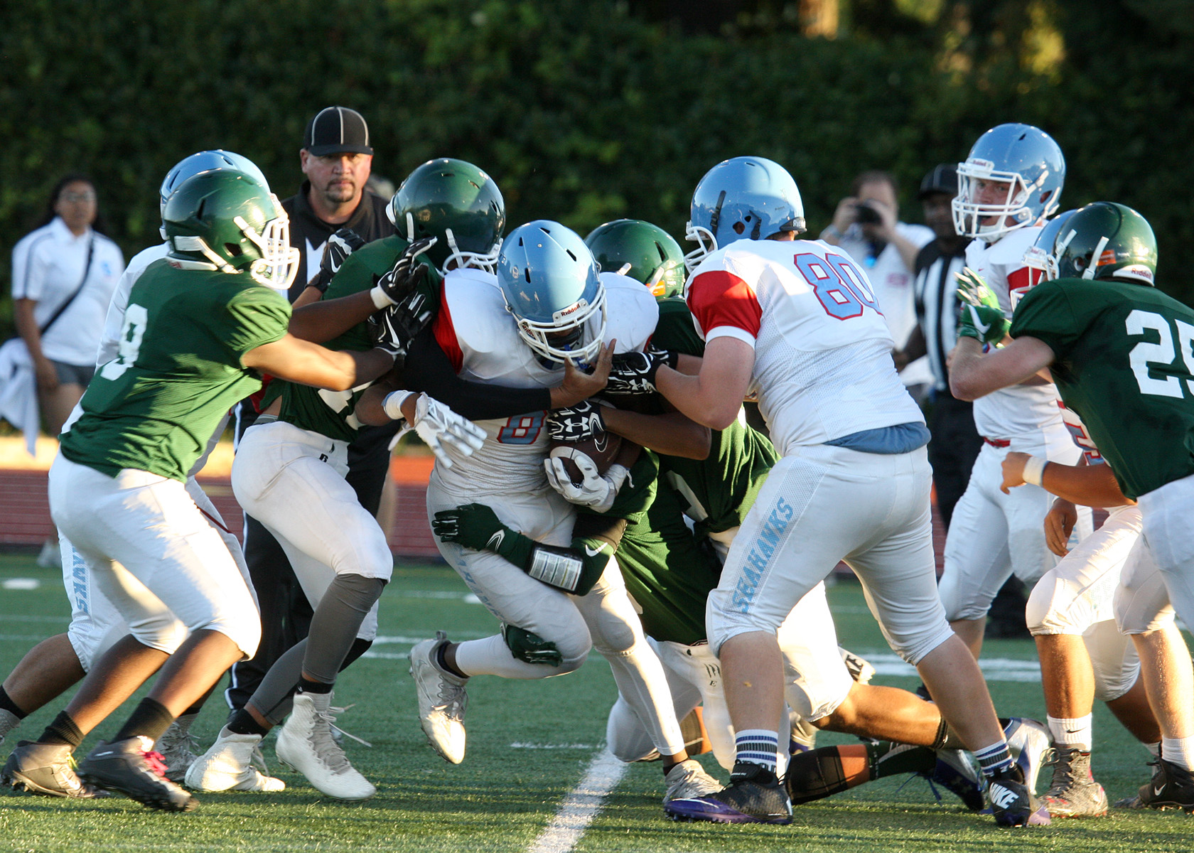 Dontae McMillan of Chief Sealth is brought down by Evergreens defense.