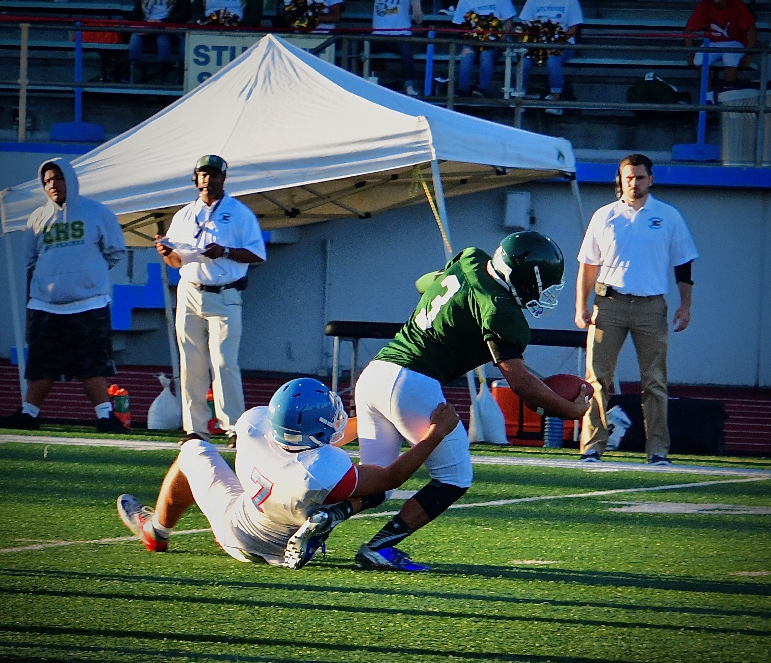 Evergreen's Jimmyt Leota gets tackled. Photo by Patrick Robinson