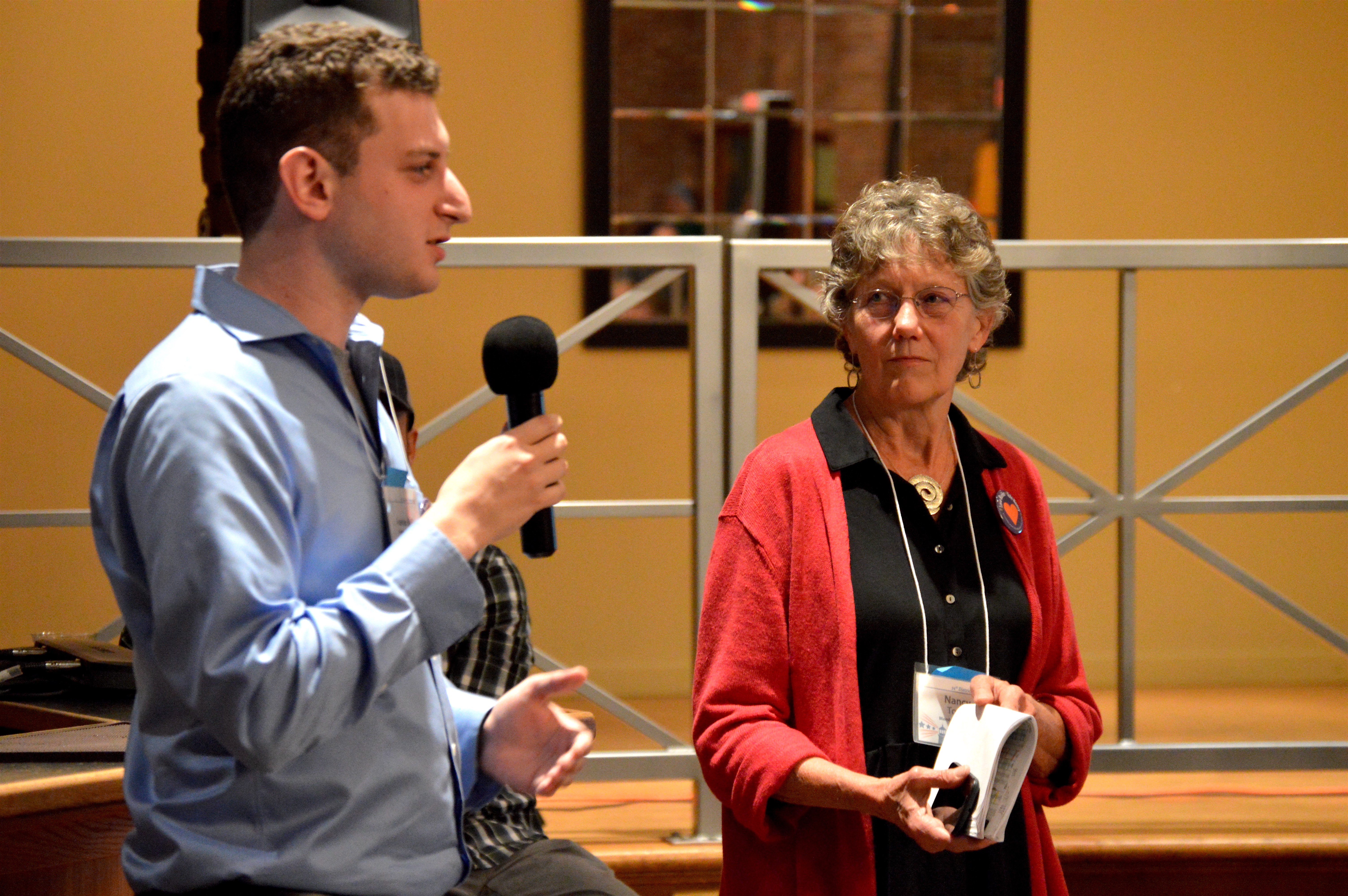 Austin Bell and Nancy Tosta addressed the 34th District Democrats