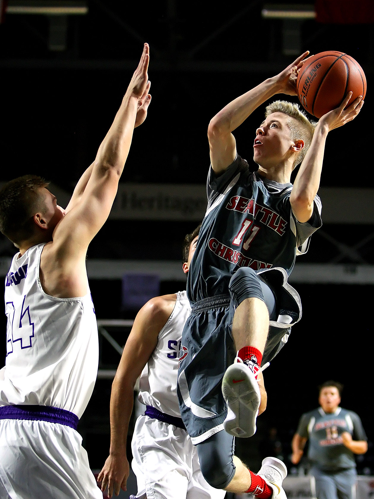 Connor Knack of Seattle Christian puts up a shot against Sumner’s Brock Denison.