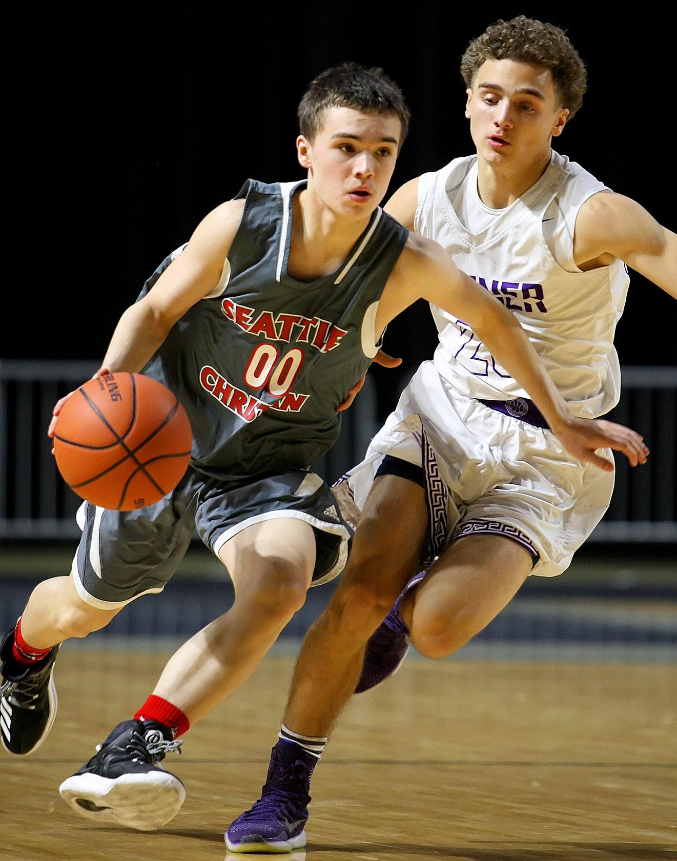 Alex Clear of Seattle Christian drives past Sumner’s AJ Andino.