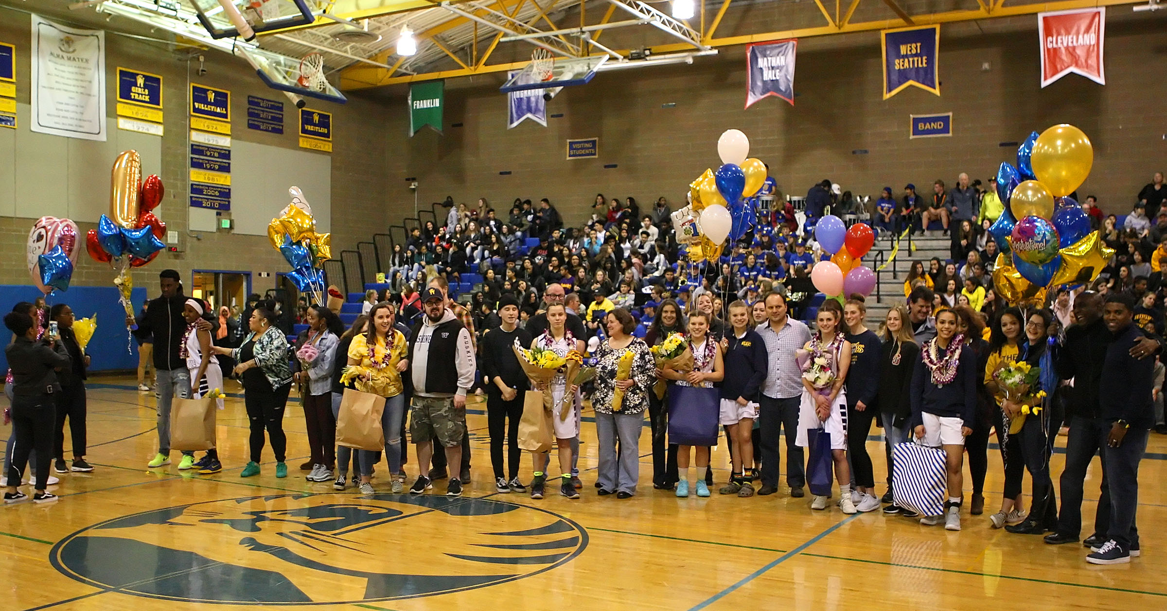 West Seattle players and their families pose for a photo.