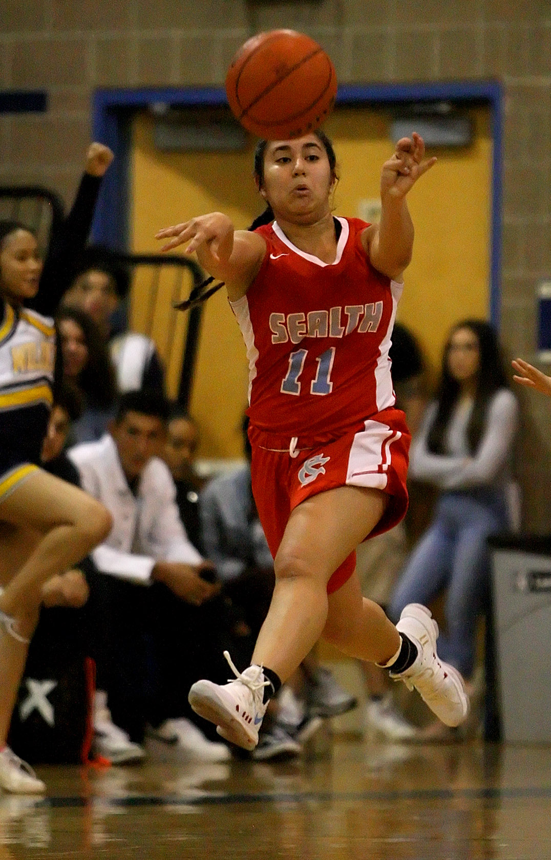 Aundra Tuchscherer of Chief Sealth passes the ball down court to a teammate.