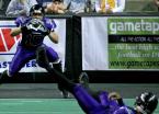 Quarterback Charles McCullum (on his back) of the Timberwolves throws a sidearm pass to Andre Piper-Jordan where the official calls the ball down just inches from the goal line.
