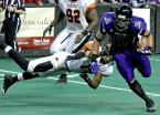 Andre Piper-Jordan avoids a tackle from Omaha Beef player Matt Hewitt.