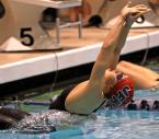 Amanda Thach of Kennedy Catholic pushes off on her way to win in the 100 yard backstroke.