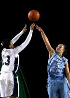 Raven Benton of Federal Way puts up a shot over the outstretched arm of Mt. Rainier's Maylynn Mitchell.