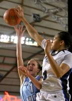 Jordan McPhee of Mt. Rainier has her shot rejected by Federal Ways Talia Walton.