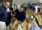 Mt. Rainier's coaches discus strategies with the team during a timeout.