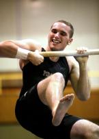 Highline's Travis Deslongchamp pulls himself up on bars.