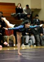 Tuyet Nguyen of Evergreen holds her scale during her floor routine.