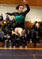 Evergreen's Ariel Rova performs a split leap on the floor.