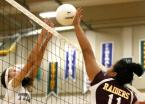 Andrina Tanielu taps the ball over the net against Beamers Sophie Miller.