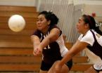 Both Andrina Tanielu and Leona Tanielu of TJ go for the ball.