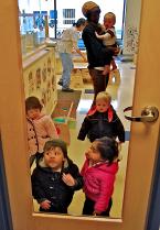 A boy does what anyone would with a glass door. Photo by Patrick Robinson