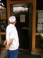 A chef for more than eight years reads the closing notice. Photo by Patrick Robinson
