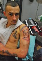 Travis McGrath, a childhood friend, had Jeremy's face tattooed on his shoulder. Photo by Patrick Robinson