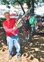 Mark Ufkes, WC Chamber Pres. and scout leader gave his chainsaw a workout. Photo by Patrick Robinson