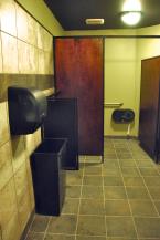 The men's room has all new tile and fixtures including a drink rail. Photo by Patrick Robinson