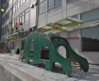 The playground adjacent to the building features a Stegosauraus. Photo by Patrick Robinson