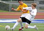 Julio Medina of TJ and Kentlake's Jacob Grabowski go after the ball. IMG_7595 5x7 300dpi.jpg