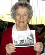 Carol Richards shows a photo of the Wilcox blacksmith shop from around 1897. The shop, owned by her parents, was just east of Sunnydale Elementary in Burien. History museum 2.jpg