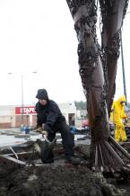 Artist Karen Cusolito digs out around the sculpture. news01-C .jpg