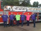 Firefighers from Ladder 11and Engine Co. # 32 hold up the the 'Love the Life you Live' shirts. Photo by Rebecca Polivy firefighters.jpg