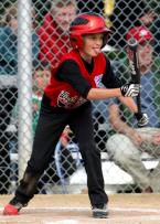 Bat up, tongue out as Jack Page of West Seattle shows bunt. Photo by Kurt Howard IMG_9218 5x7 300dpi.jpg