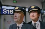 DREAMLINER PILOTS. Capt.Tatsuya Nomura, deputy director of light operations for All Nippon Airways (ANA), Capt. Taiju Suematsu, ANA  director of flight operation supports, pause at Sea-Tac Airport gate S16 after flying the first Dreamliner into Sea-Tac.