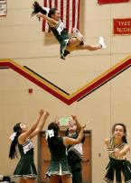 Evergreen cheerleaders do the, throw one of your cheerleaders high into the air, routines.