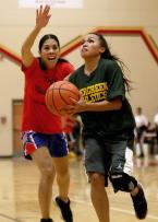 An Evergreen player takes it to the hoop.