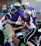 Nathan Gordan of Highline runs into Ballard's defensive wall.