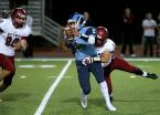 Mt Rainier's quarterback Jersiah Tafia can't get away from Bethel's Cody Ford.
