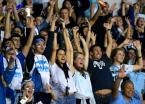Mt Rainier's fans react to the cheerleaders on the field.