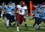 Bethel's quarterback Jamon Jones tries to get away from Mt Rainier's defense.