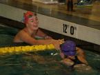 Kennedy swimmer, Natalie Mutter, shaking hands with a Highline swimmer after winning the  100 yard freestyle in a recent meet at the Foster pool.