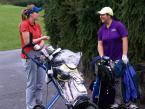 Lancers' Emily Porter, sharing a moment with Foster's Mikayla Kato during the  round of golf at the Seamount League Golf Tournament on the Auburn Golf Course greens Saturday.