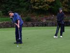Lancers' Jacob Green, putting the ball, with another school's golfer standing nearby  in the Seamount League Golf Tournament on the Auburn Golf Course.