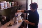In her element: Michele throws together ingredients for one of her personalized smoothies for the players.  During the interview players coming in to grab food would express how much they enjoy Michele and her nutritious concoctions.