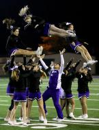 Three of Foster's high flying cheerleaders come in for a landing.