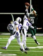 An Evergreen player (number & name not in program) makes a great catch as Foster's Zane Jacobson can't knock the ball away.