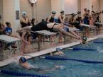 Rams' Erin Ronald diving off the block at the start of her leg of the 200 medley relay, in the 4A West Central District meet at the Curtis pool Saturday.