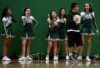 Evergreen cheerleaders react as bags of popcorn pass them by and are taken to the scorers table.
