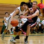 Alexis Rivera of Evergreen drives baseline past Kennedy Catholic's Jacob Thurbe