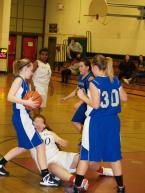 The Lady Lions' Abby Turner has gone to the floor on this play of a game against Three Rivers Christian on Friday.