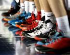 An assortment of different colored shoes adorn Kennedy Catholic's bench.