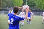 A Shorewood player throwing the ball in with the Lancers' Jake Zwaller, and, Simon Thomas (background) ready on defense.